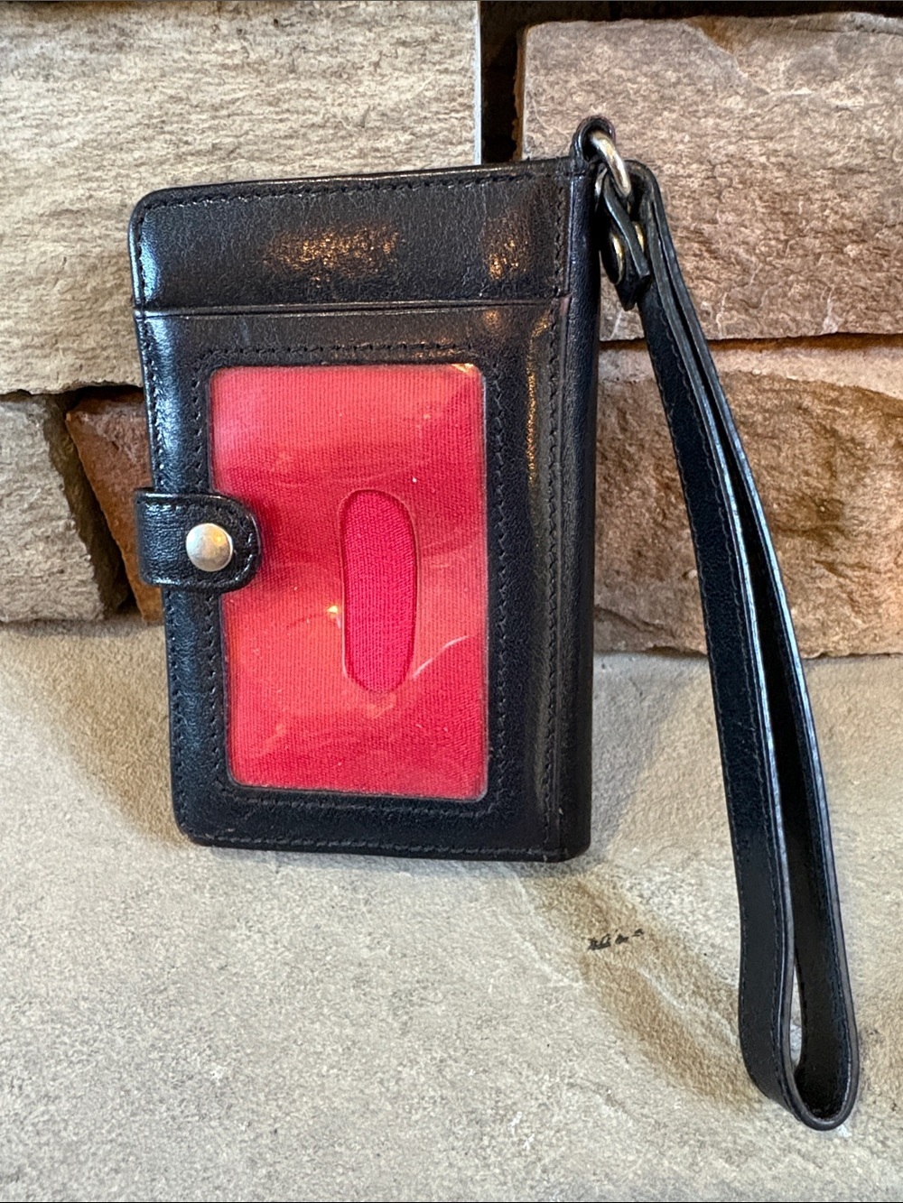 Hobo black leather wristlet wallet with red accent color